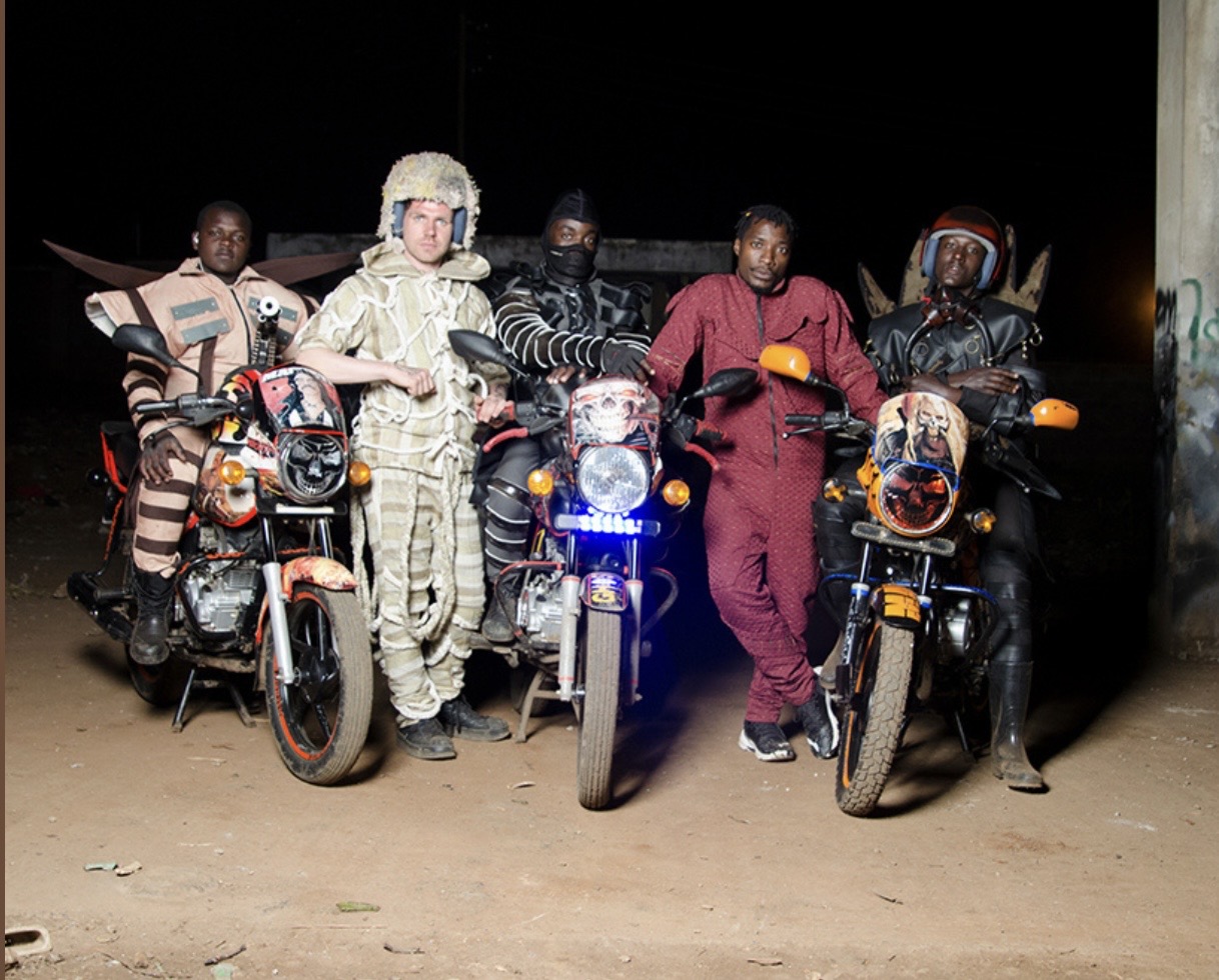 Boda Boda Madness — group of Nairobi motortaxi drivers with Bobbin Case custom-designed outfits on their fantastically-themed motorcycles at night